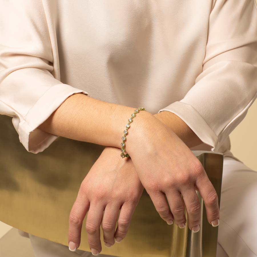 Woman Wearing Ella Medical ID Bracelet in Gold and Cubic Zirconia