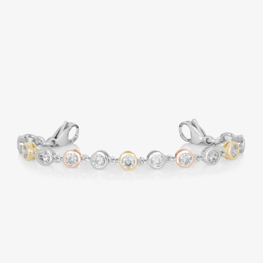 Bracelet featuring individually set, round cubic zirconia crystals, in alternating silver, rose and gold tones.