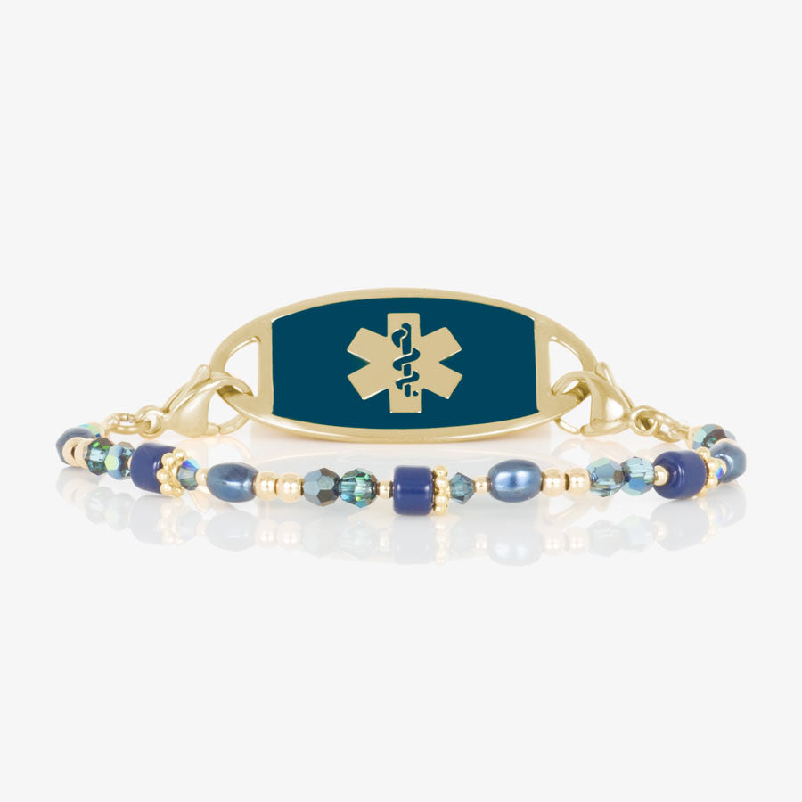 Blue and gold beaded medical ID bracelet on jewelry elastic with gold tone lobster clasps and sapphire blue decorative med ID tag.