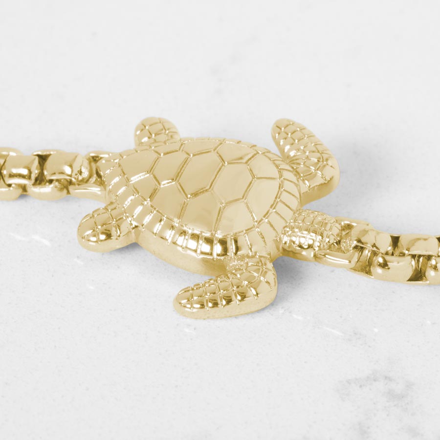 Close up of gold tone sea turtle centerpiece