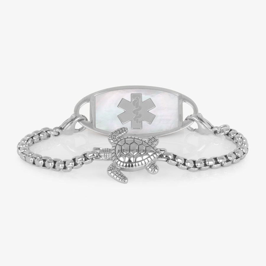 Silver box chain bracelet featuring a sea turtle centerpiece, attached to a stainless steel medical ID with mother of pearl inlay.