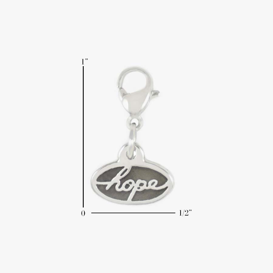 Scale of 1” by 1/2" Silver Tone Hope Charm. Stainless charm with the word, “hope” in block letters on the back, lobster clasp