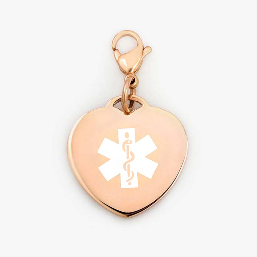 Heart-shaped, rose gold tone medical alert charm with white symbol on matching rose lobster clasp