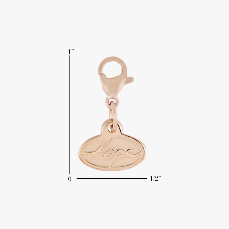 Scale of the back of the 2-sided Rose Gold Tone Hope Charm with the word, “Hope” in block letters, with lobster clasp