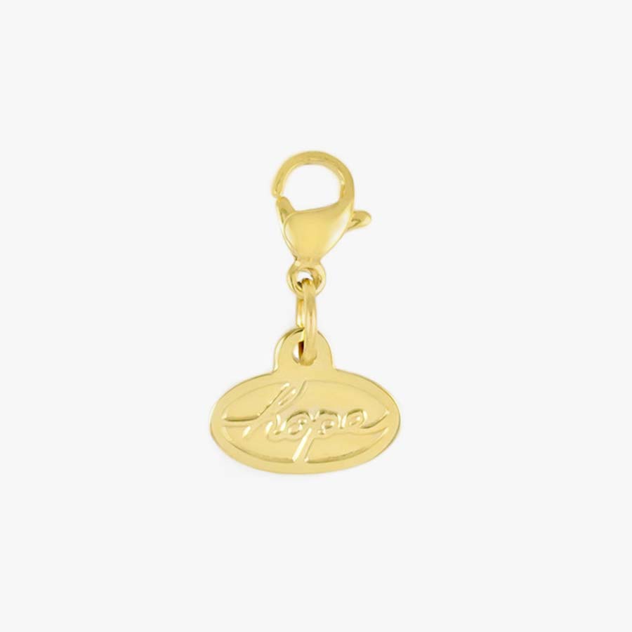 Gold tone lobster clasp and oval shaped charm with the word HOPE in script lettering.