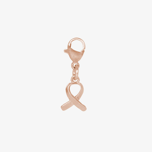 Rose gold tone awareness ribbon charm attaches to bracelet or necklace with lobster clasp.