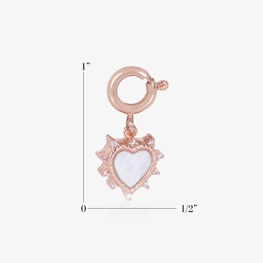 Rose Gold, heart shaped charm measuring 1 in tall by 1/2 inch wide