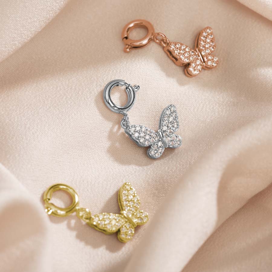 Butterfly charms in Gold, Silver and rose gold sparkle with inlaid crystals on front and back.