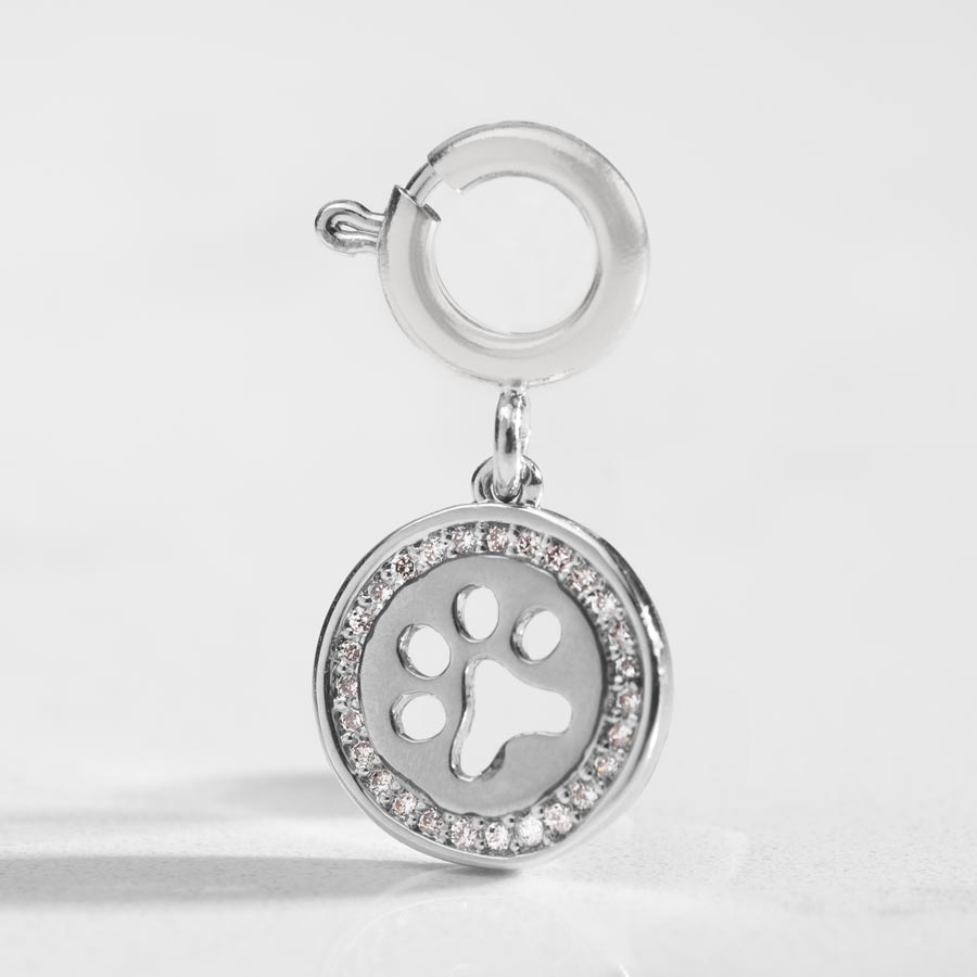 Detail shot of silver paw cut out charm