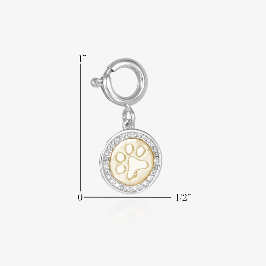 Attachable Charm featuring a cutout paw print encircled with clear, pave-set cubic zirconia crystals. Measurements showing a height of 1-inch and width of 1/2-inch