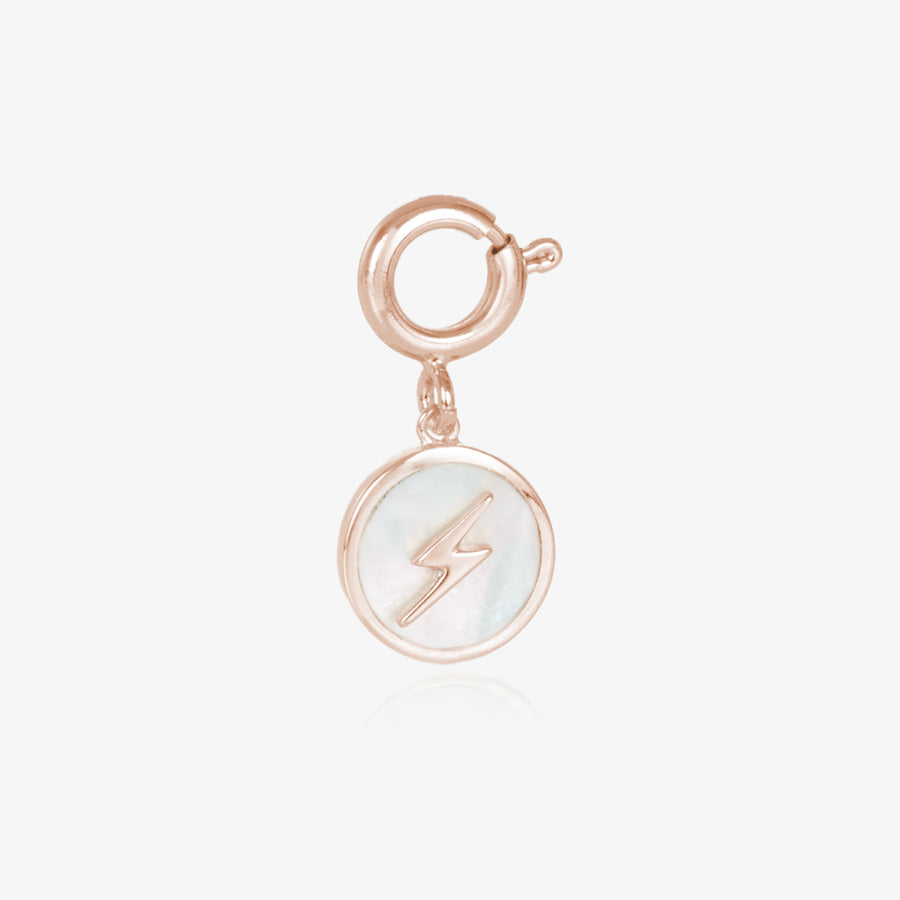 Round, rose gold tone charm, featuring a mother of pearl inlay with rose gold lightning bolt.