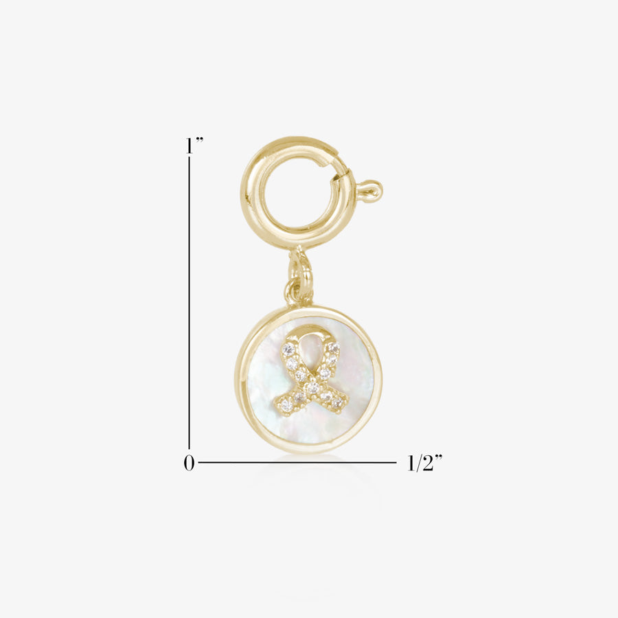 Gold tone round charm with mother of pearl inlay and gold awareness ribbon with inset crystals. Showing measurement of one inch by one half inch.