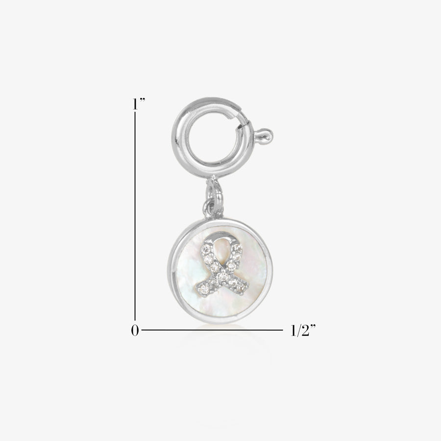 Silver tone round charm with mother of pearl inlay and gold awareness ribbon with inset crystals. Showing measurement of one inch by one half inch.