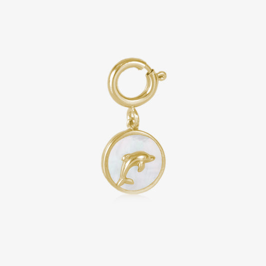 A gold toned, circle shaped charm, featuring a gold toned dolphin on a field of inlaid mother of pearl.