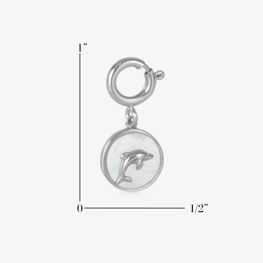 ROund, silver charm with a silver dolphin inset on an inlay of mother of pearl, measuring one inch by onehalf inch