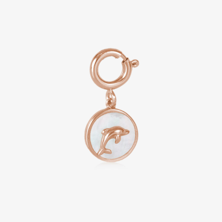 A rose gold tones, circle shaped charm, featuring a rose gold tones dolphin on a field of inlaid mother of pearl