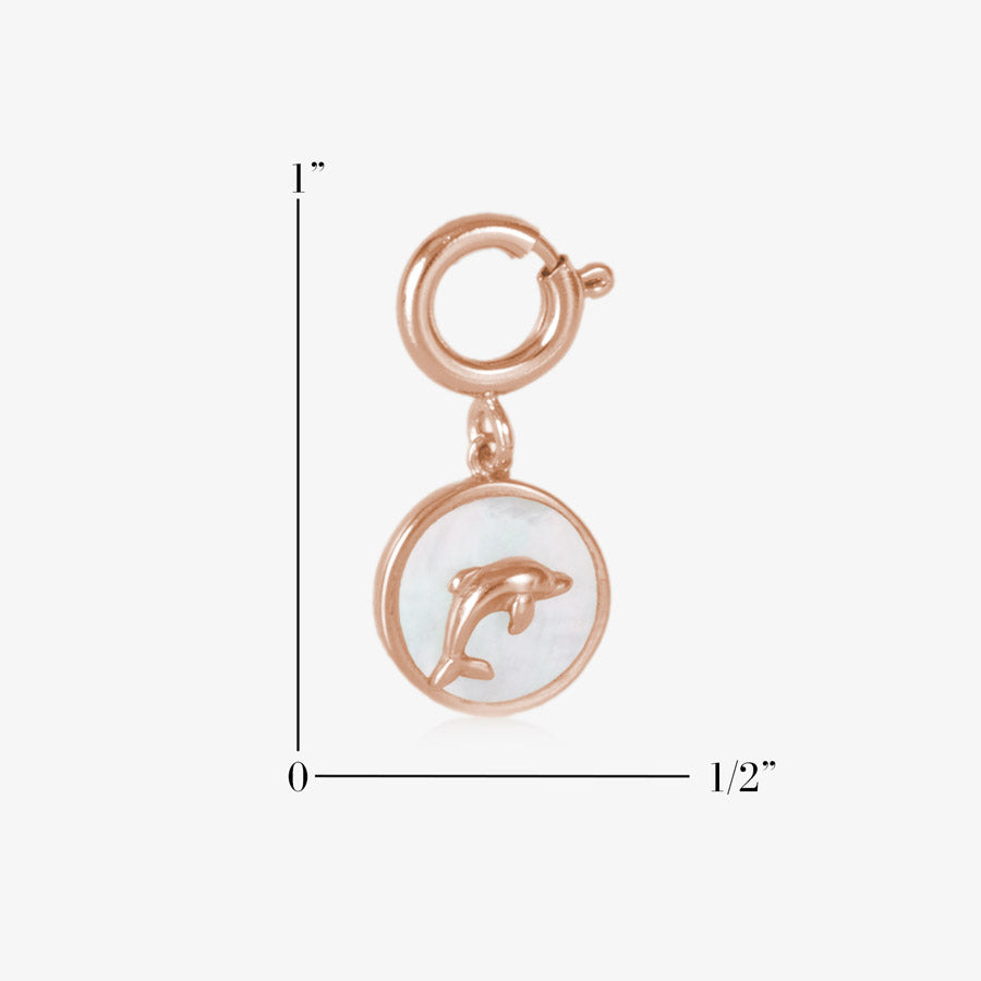 Circle shaped charm with dolphin inset on a field of mother of pearl measuring one inch by one half inch