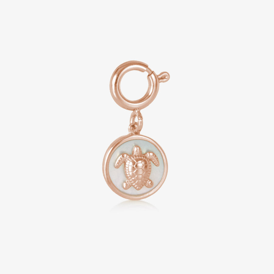 Rose gold, round, sea turtle charm featuring mother of pearl inlay.