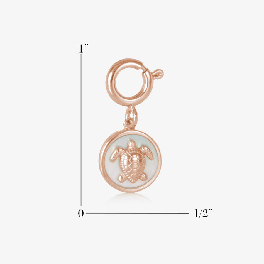 Rose gold, round, sea turtle charm, featuring mother of pearl inlay, showing measurements of one inch by one half inch