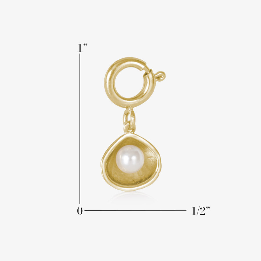 12k gold plated open oyster shell charm featuring a single, lustrous pearl, measuring one inch by one half inch.