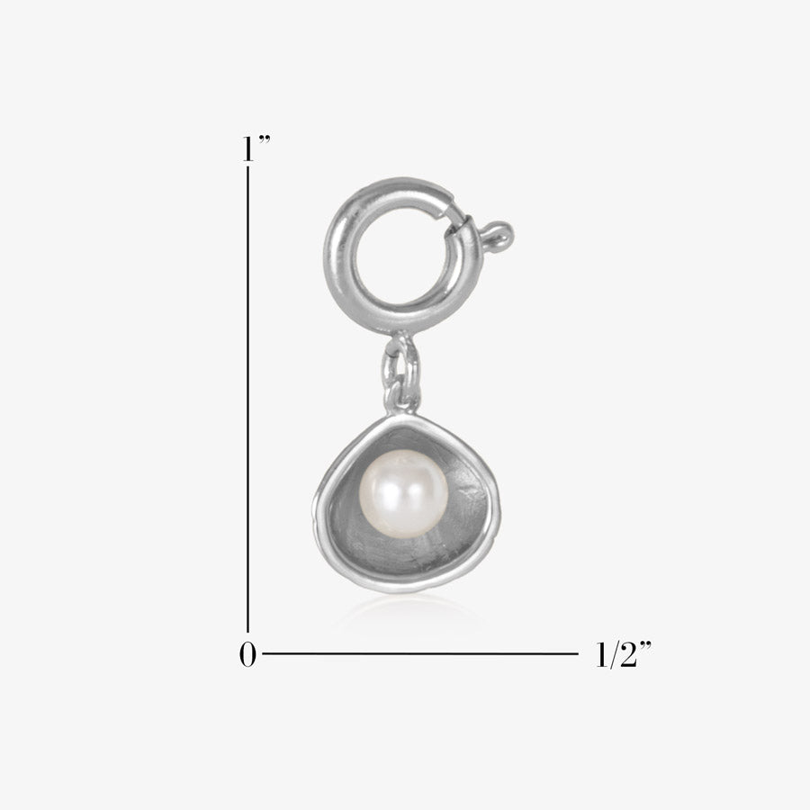 Sterling silver open oyster shell charm featuring a single, lustrous pearl. Measuring one inch by one half inch