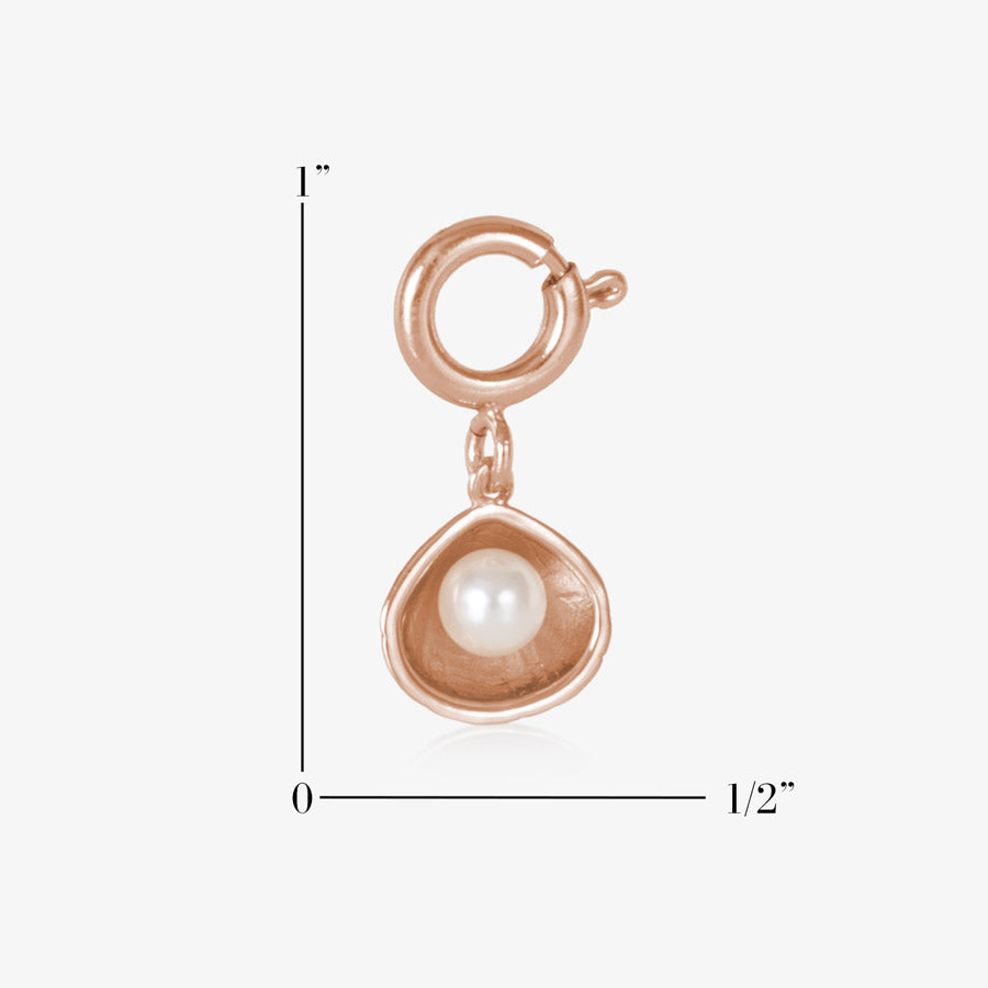 14k rose gold plated open oyster shell charm featuring a single, lustrous pearl, measuring one inch by one half inch.