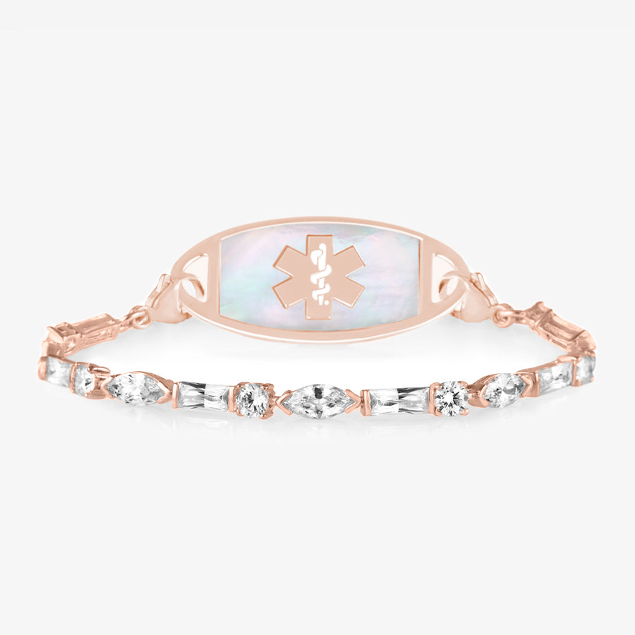 Rose gold tone medical ID bracelet with round, rectangle, and oval clear cubic zirconia crystals paired with rose gold tone med ID tag with mother of pearl inlay and rose gold medical symbol.