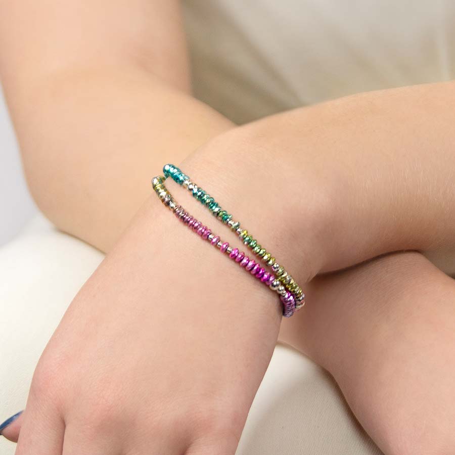 Woman wearing multicolored medical alert bracelet with colorful blocks of beads