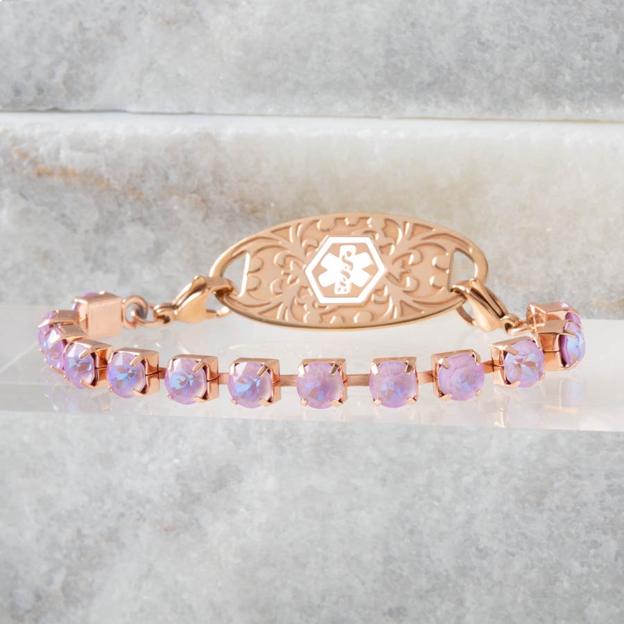 Lavender crystal medical ID bracelet artfully set on stone background