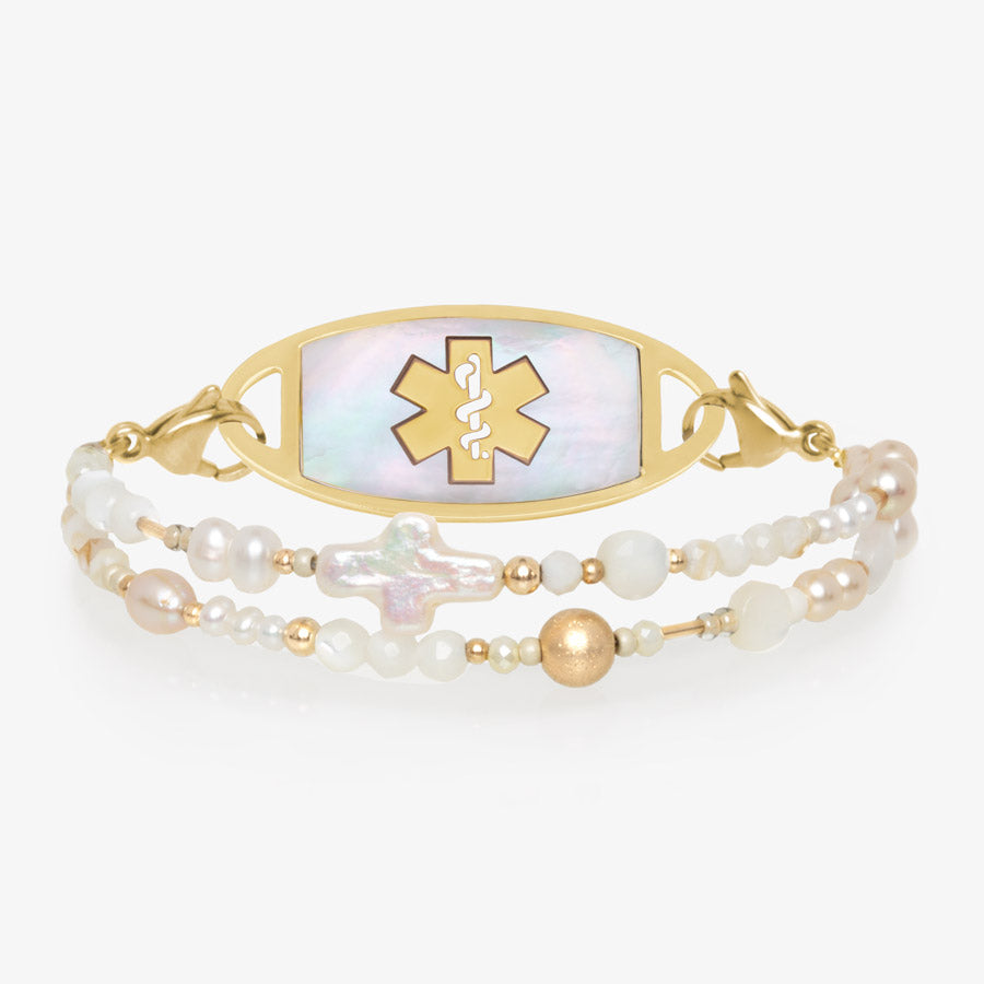 Beaded mother of pearl, white quartz, and gold tone beaded medical ID bracelet with gold tone oval cross med ID tag with white symbol.