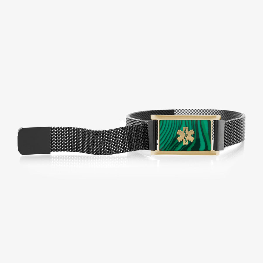 Black stainless steel mesh band affixed to gold tone stainless steel medical ID tag with malachite inlay and gold tone medical symbol.