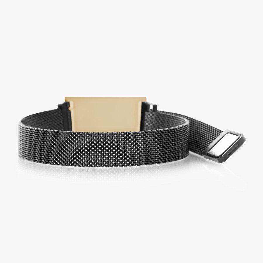 Back side of black stainless steel mesh band showing back of gold tone stainless steel medical ID tag and magnetic clasp opened.