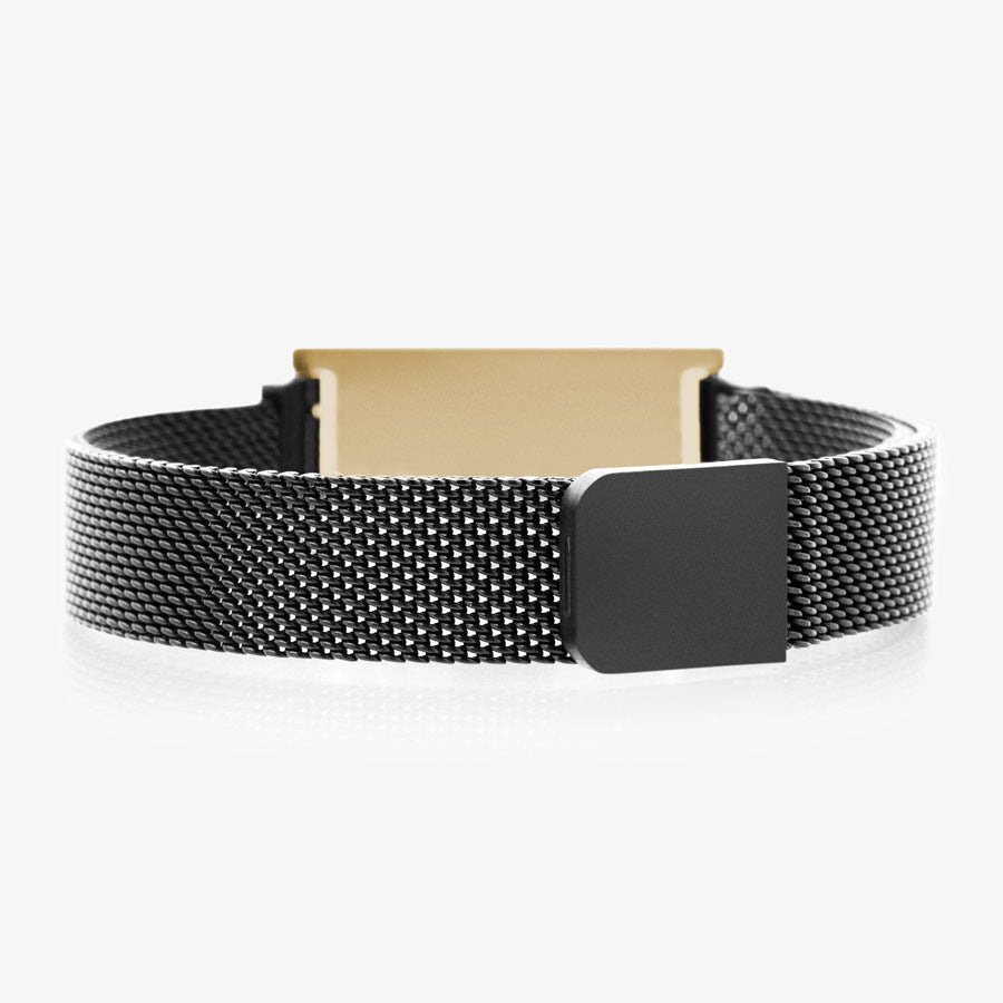 Back side of black stainless steel mesh band showing back of gold tone stainless steel medical ID tag and magnetic clasp.