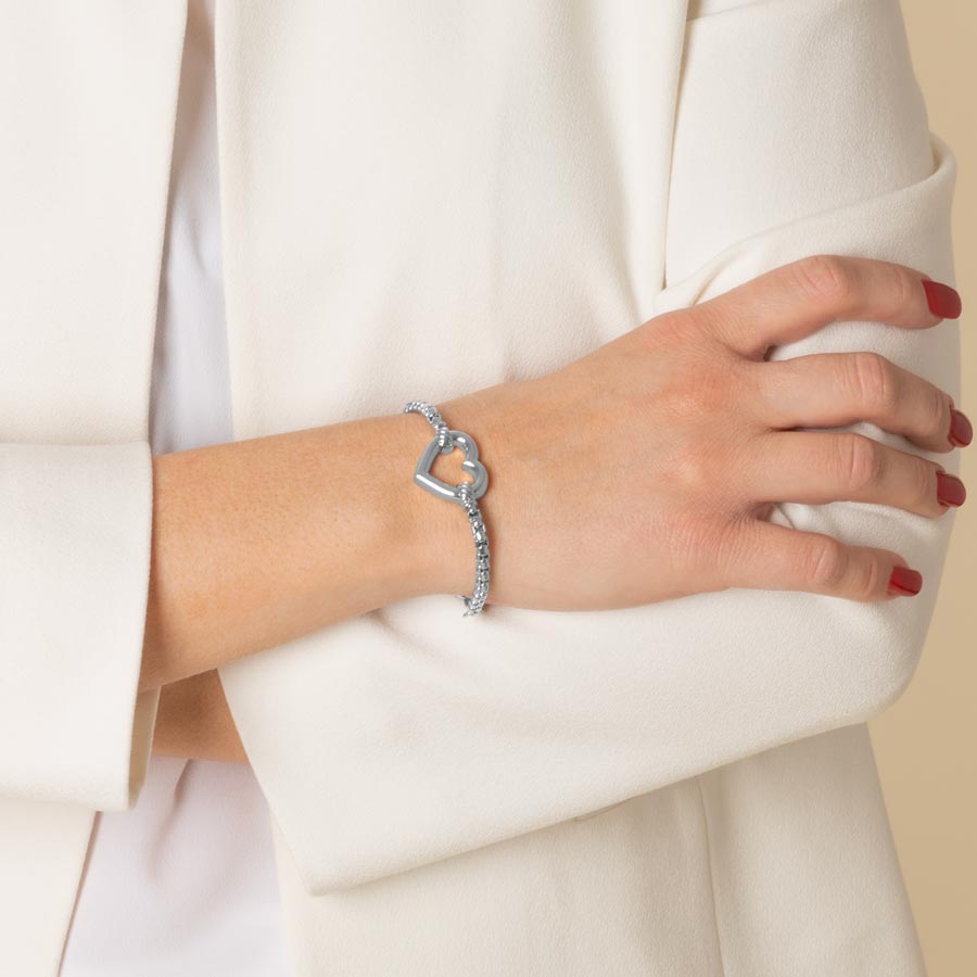 Woman wearing medical ID bracelet with Heart centerpiece in Silver