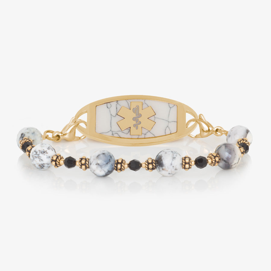 Dendritic opal, black crystal, and gold beaded medical ID bracelet paired with gold tone stainless steel medical ID tag with black paint inlay and gold tone medical symbol at the center.