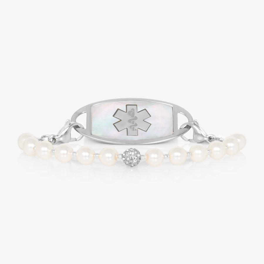 Pearl and sterling silver stretch medical ID bracelet with sparkly silver centerpiece and stainless steel medical ID tag with mother of pearl inlay and stainless steel medical caduceus symbol.