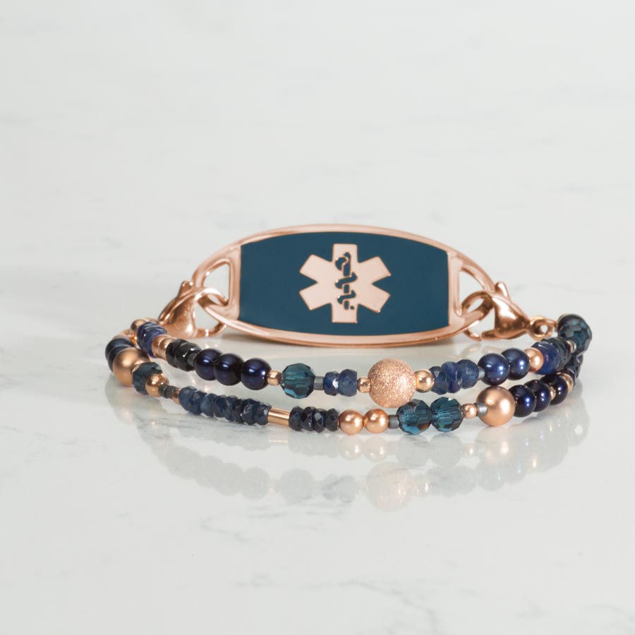 Lotus Beaded Medical ID bracelet paired with Rose Gold and Sapphire Medical ID Tag on white marble counter