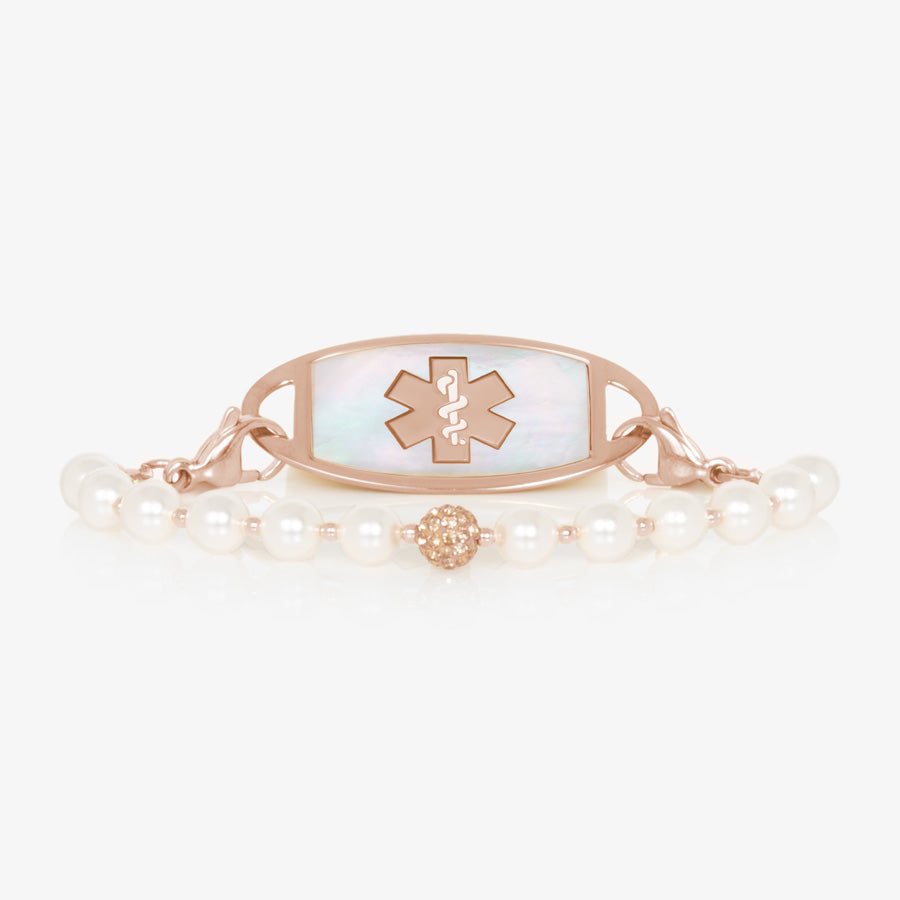 Pearl and rose gold tone stretch medical ID bracelet with sparkly rose gold tone centerpiece and rose gold tone stainless steel medical ID tag with mother of pearl inlay and rose gold tone medical caduceus.