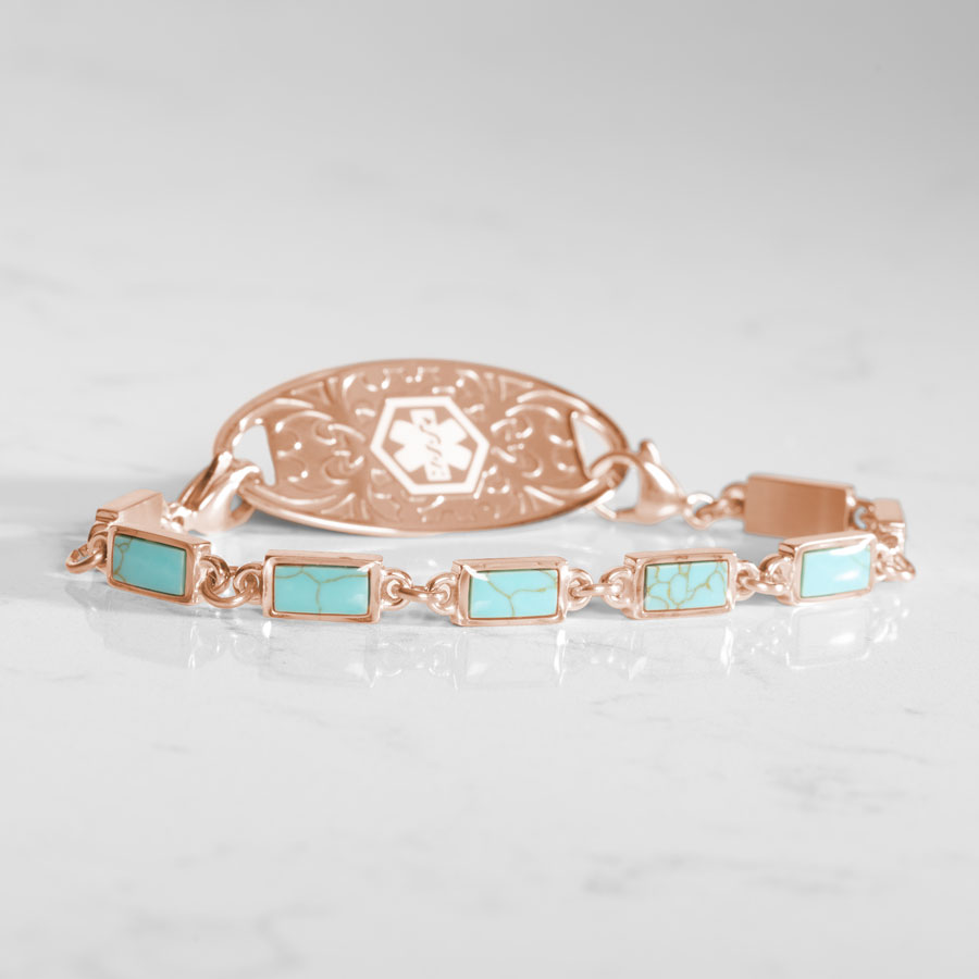 Medical ID chain bracelet with turquoise and rose gold links displayed with decorative rose gold medical ID Tag.