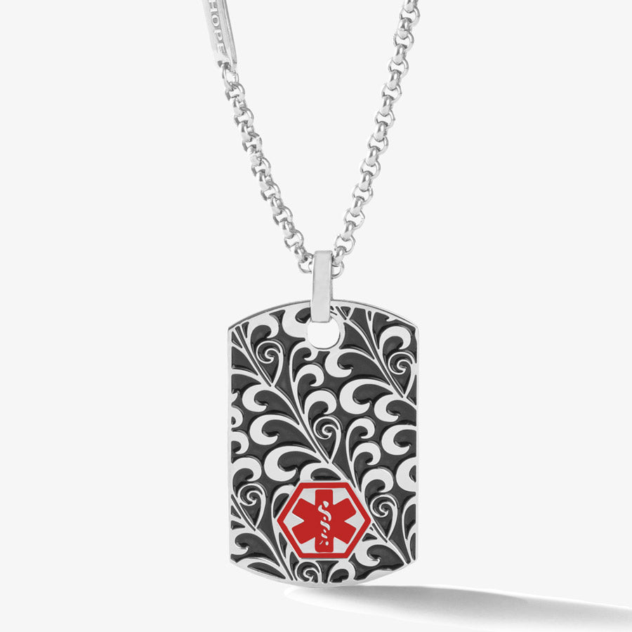 Stainless steel, silver tone medical alert pendant with scrolling filigree design and red medical symbol