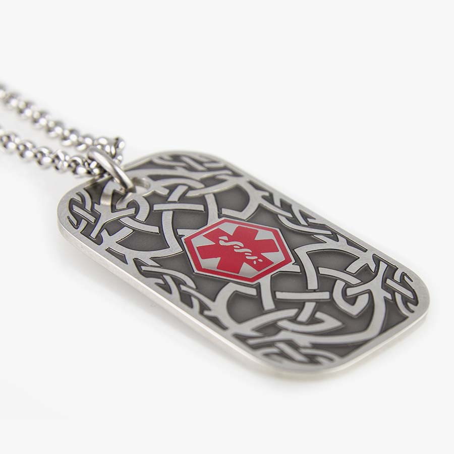 Med ID Dog Tag Necklace. Stainless silver tone tag with raised Celtic branch pattern and red caduceus on stainless rolo chain