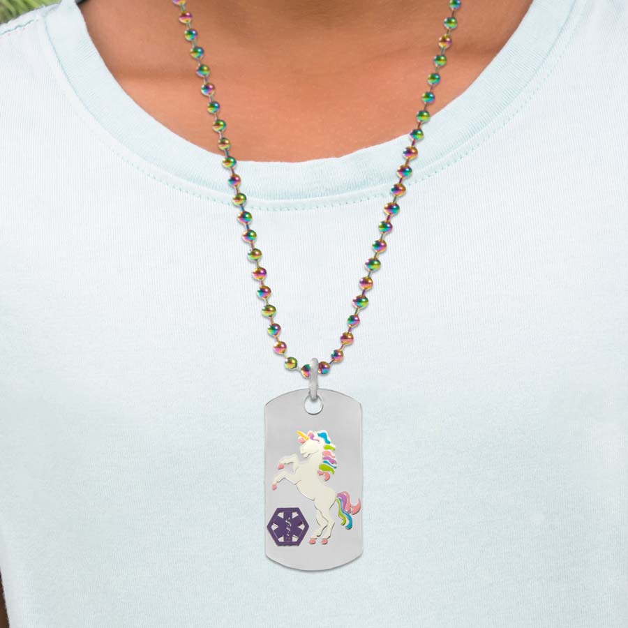 Young girl wearing unicorn medical ID alert dog tag necklace with magic finish ball chain