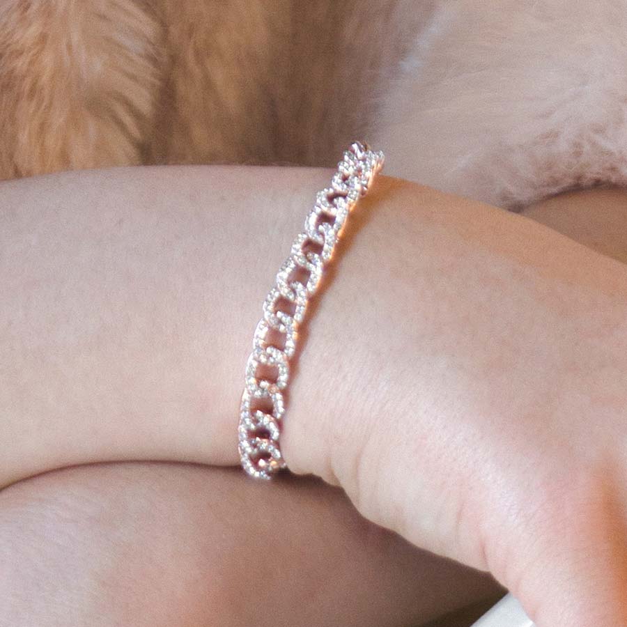 Woman wearing rose gold dipped sterling silver curb chain medical alert bracelet