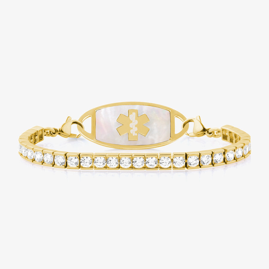 12 karat gold plated med ID tennis bracelet with clear cubic zirconia crystals and gold tone stainless steel med ID tag with white symbol.