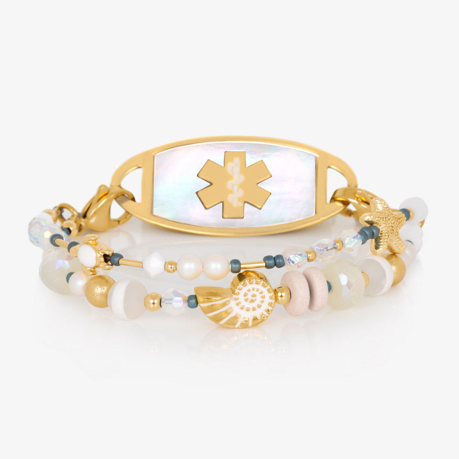 Crystal and pearl beaded medical ID bracelet with sea themed focal beads paired with gold tone medical ID tag with mother of pearl inlay.