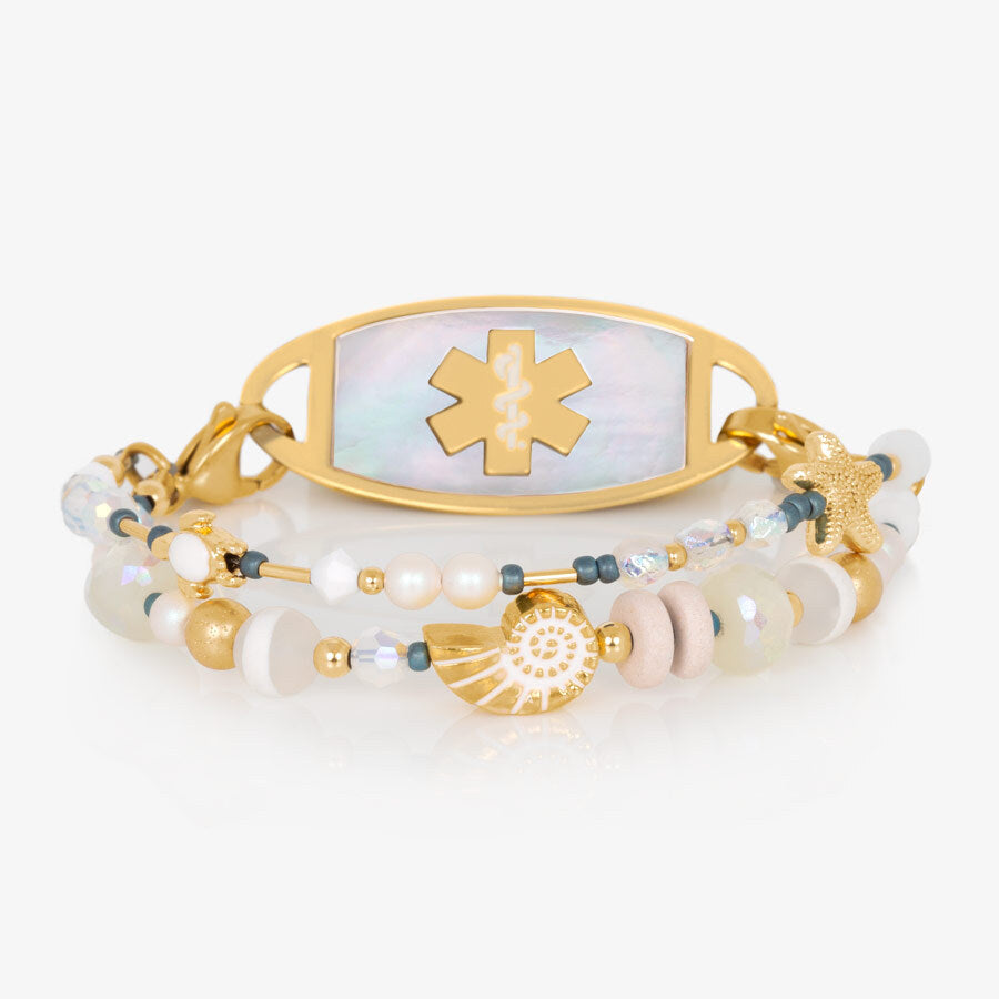 Crystal and pearl beaded medical ID bracelet with sea themed focal beads paired with gold tone medical ID tag with mother of pearl inlay.