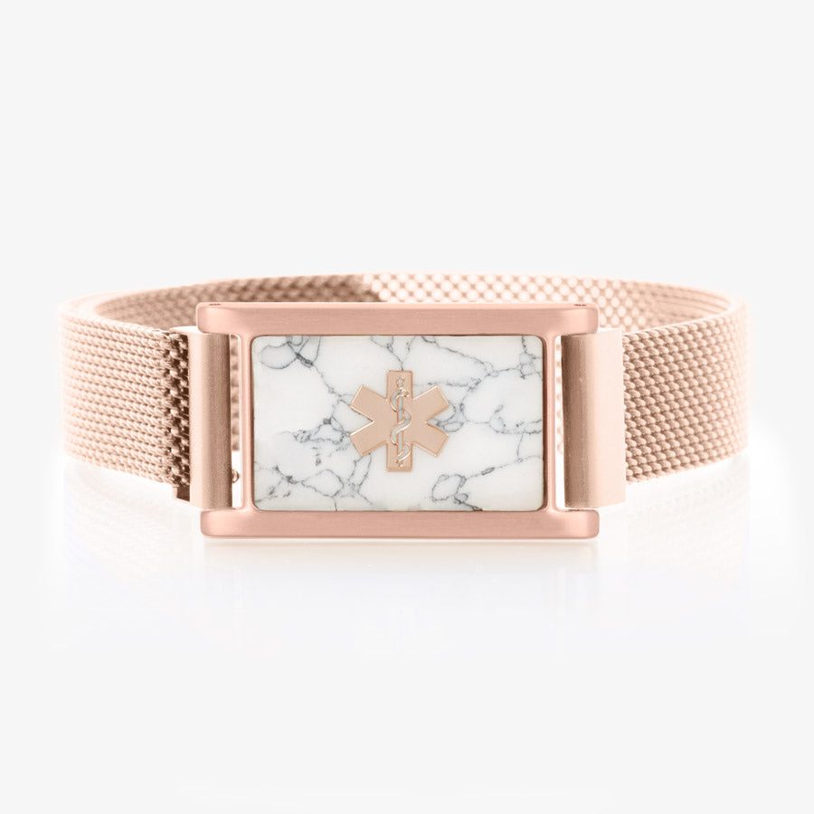 Rose gold tone stainless steel, adjustable mesh band with magnetic clasp affixed to rose gold tone stainless steel medical ID tag with howlite inlay and coordinating rose gold tone medical symbol.