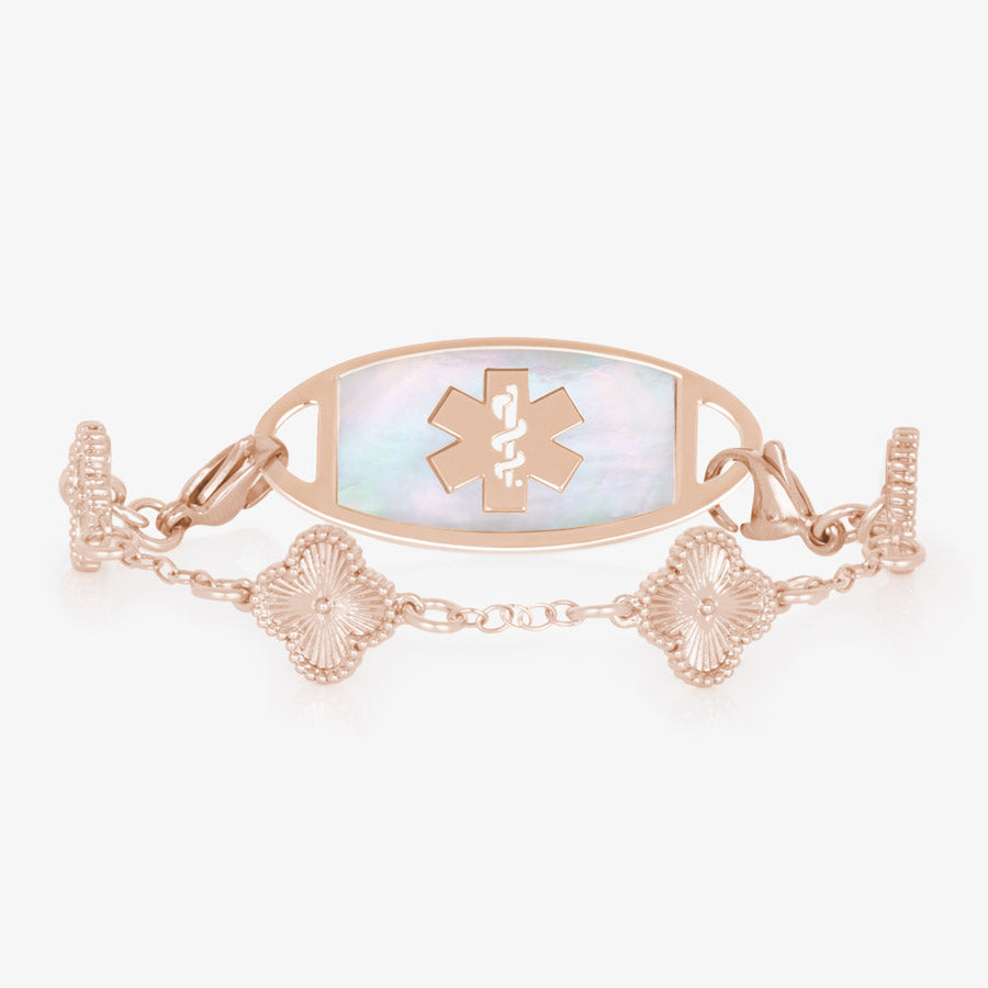 14k rose gold plated clover shaped medical ID bracelet with starburst textured inlay paired with rose gold tone stainless steel ID tag with mother of pearl inlay and rose gold tone medical symbol at the center.