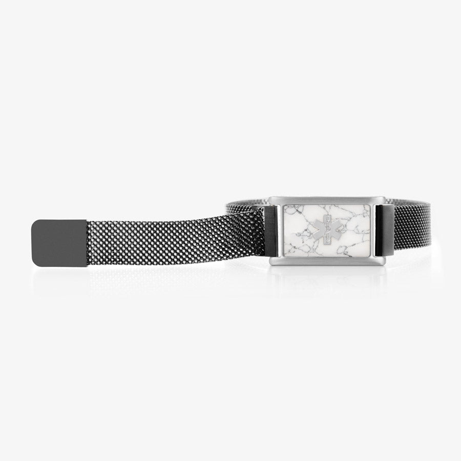 The front side of the black stainless steel medical ID bracelet with silver medical ID tag with howlite inlay with adjustable mesh band extended.