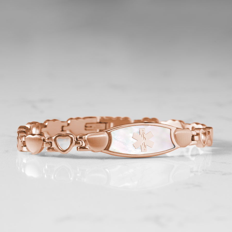 Feminine rose gold and mother of pearl stainless steel linked bracelet with rose gold medical caduceus symbol